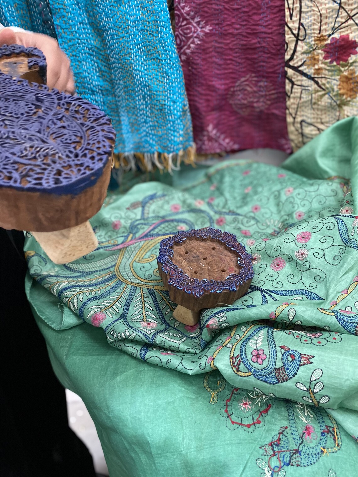 display of Kantha textiles with Indian blocks for printing