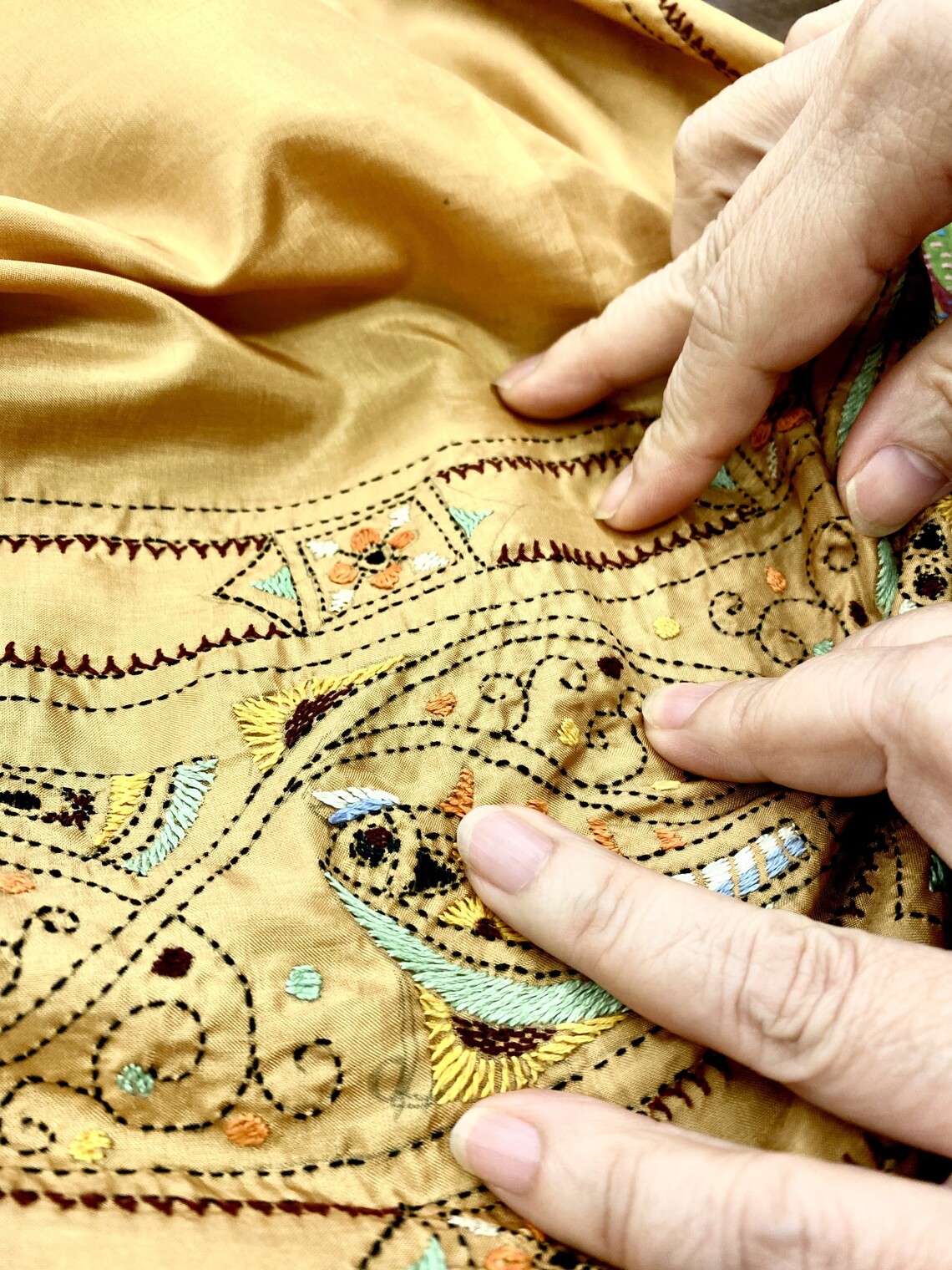 a close up of kantha embroidery on a saree