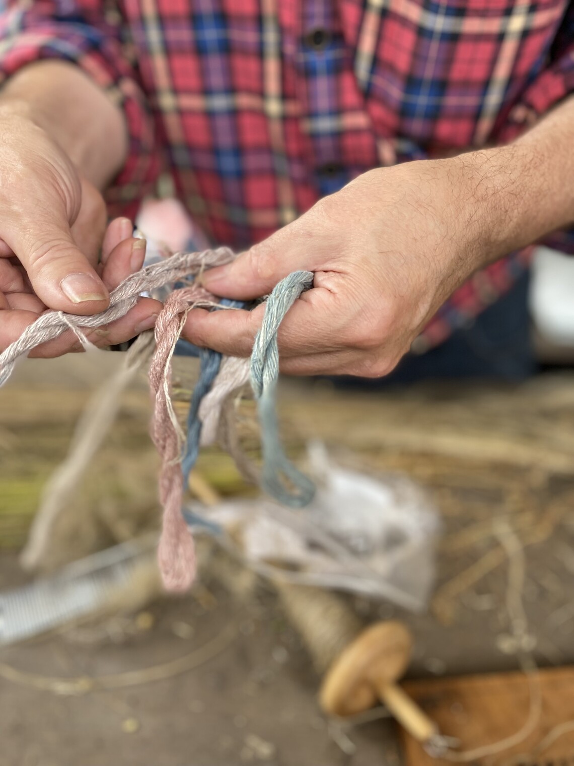 demonstration of flax yarn spinning and linen threads of different colours